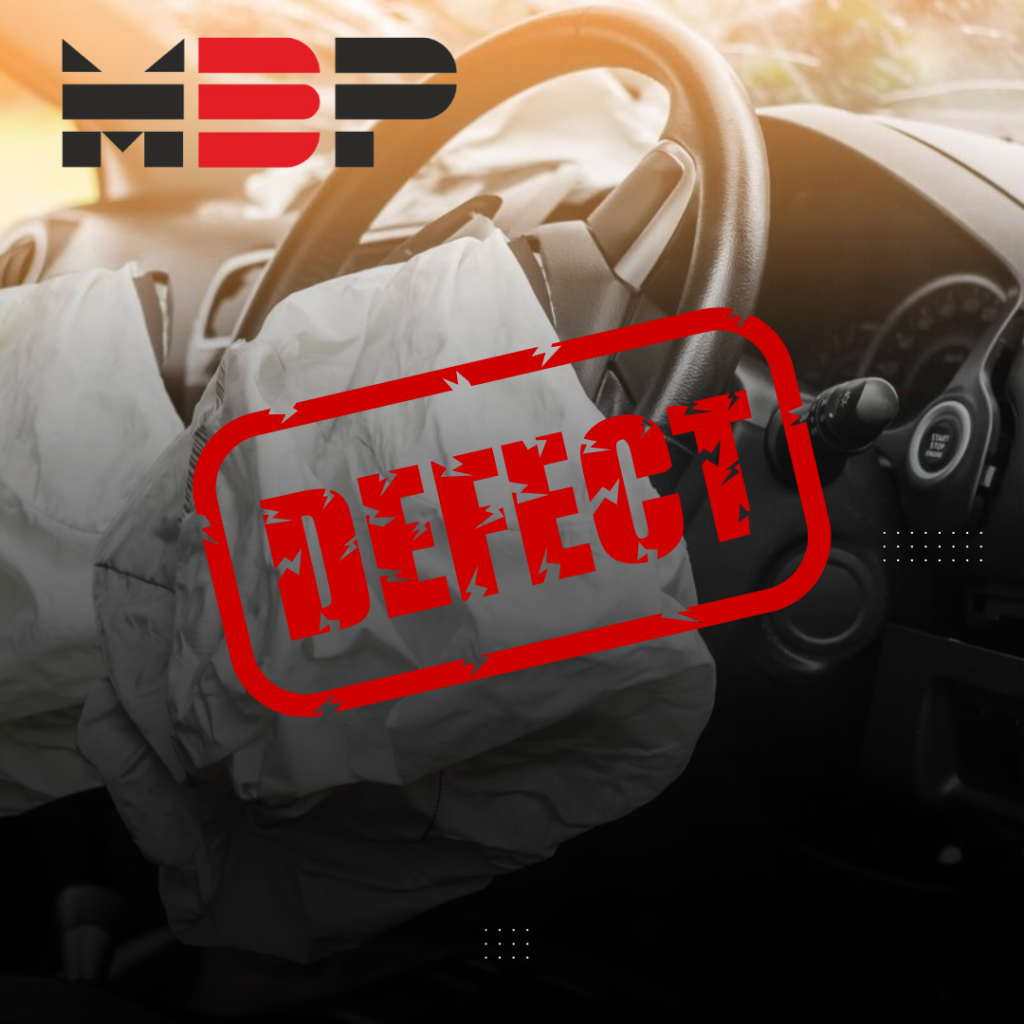 Deployed airbags in a car with a "Defect" stamp overlaid